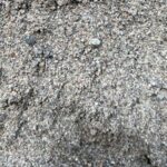 Concrete Sand (Coarse), a gritty gray sand with small pebbles, sold in bulk by Pro-Gro in Sherwood, OR