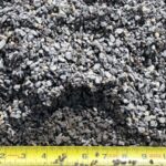 1/4″ Minus Crushed Gravel, small angular gray chips with fines, shown with a tape measure for scale