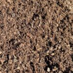Close-up of Fine Aged Fir Bark, a dark brown, finely shredded bark mulch, Portland area landscape supply